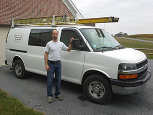 Don Rhoads with work van